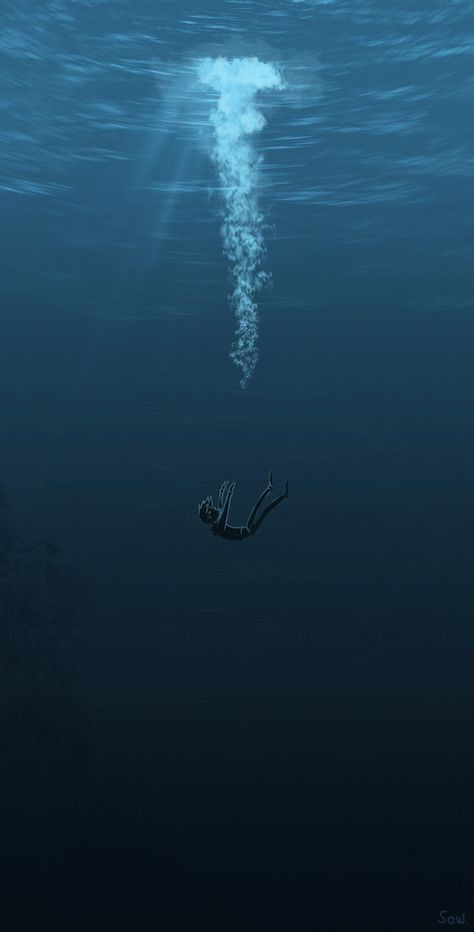 a person floating in the water with their hand up to an object that is floating above them