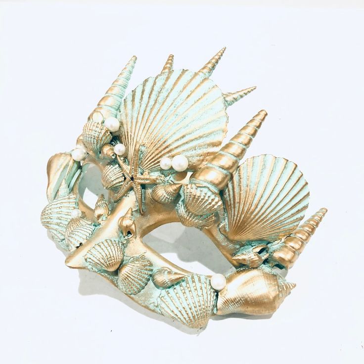 Embrace the magic of the ocean with masks inspired by the legendary King Triton and Queen Athena. One mask shines in mesmerizing copper, while the other glistens in enchanting turquoise and gold, creating a perfect complement. These masks are adorned with intricate seashell designs, ensuring you both stand out as the true rulers of the sea.


Age Group/Gender - Adult/Unisex

Size/Type - One size fits all adults

Mask Color - Copper, turquoise/gold

Mask Material - Polyresin

Accent Material - Pa Ocean Masquerade Mask, Mermaid Masquerade Mask, Seashell Mask, Greek Masks, Greek Mask, Queen Athena, Mermaid Mask, Couples Masquerade Masks, Gold Masquerade Mask