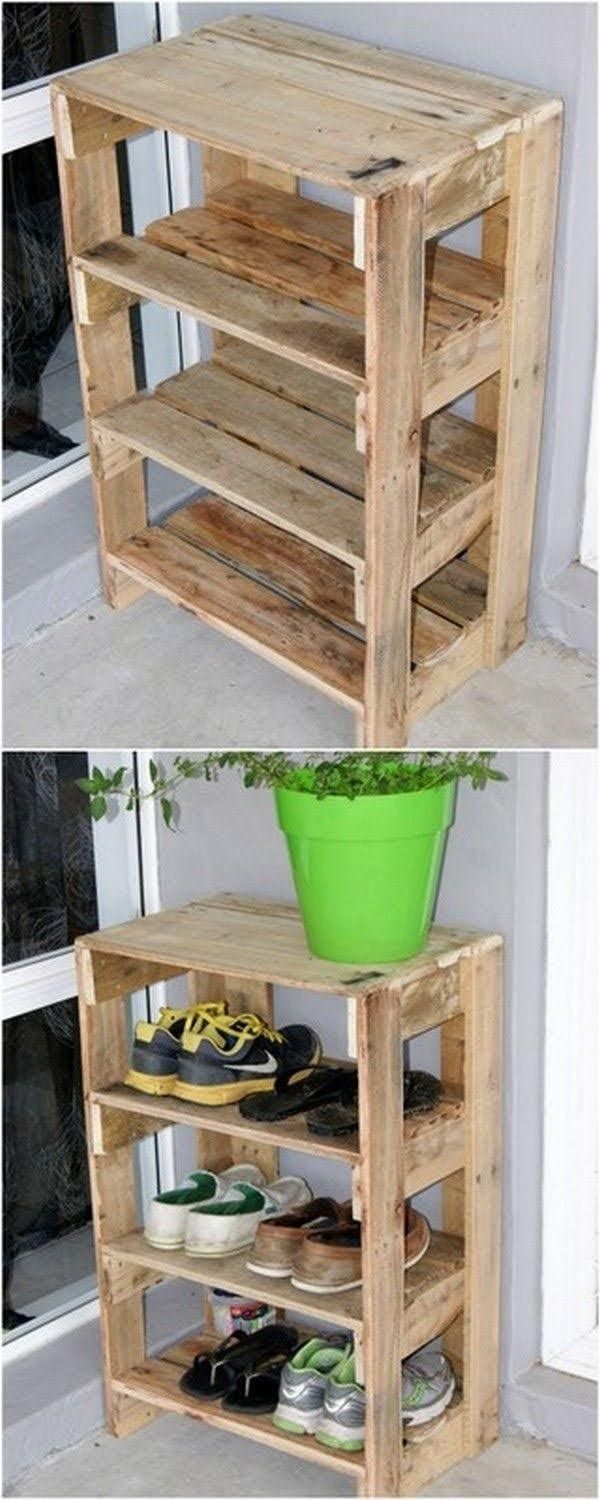 two wooden shelves with shoes on them and a green potted plant in the middle