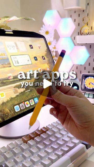 a person is holding a pencil in front of a computer screen with the words art apps on it