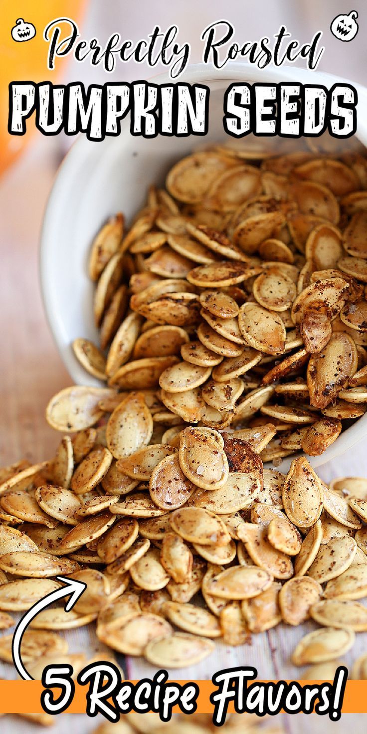 pumpkin seeds in a white bowl with text overlay that reads, perfectly roasted pumpkin seeds