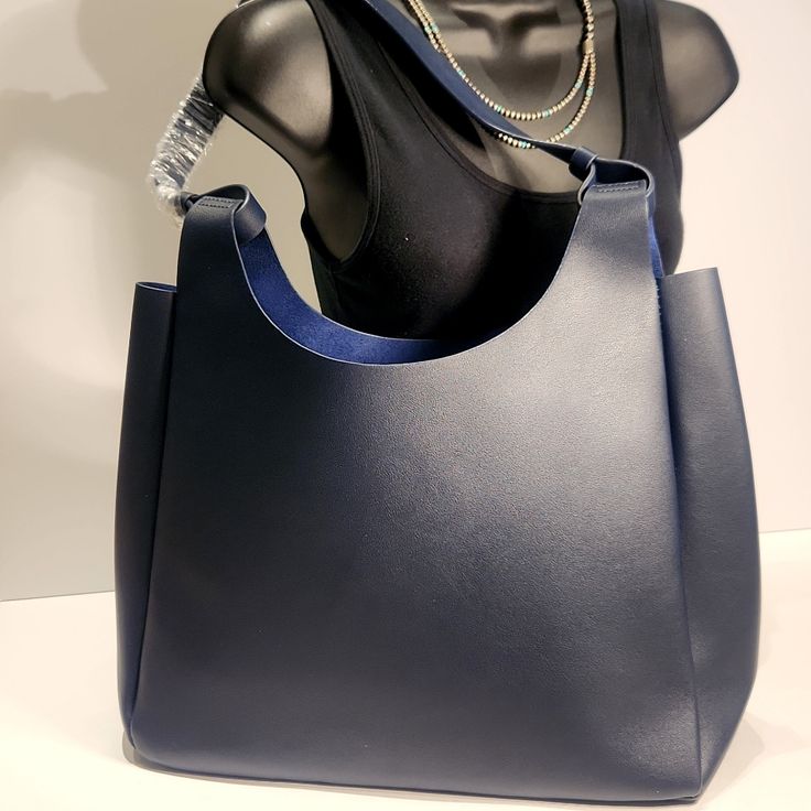 (Nwot)...Simple Yet Classic Neiman Marcos Tote, Can Be Used As A Purse Or Extra Tote Needed For Work Items! Durable Synthetic Material On Exterior Is Resistant To Stains. Strap Is 13.5" Non-Smoking Home Navy Satchel Shoulder Bag For On-the-go, Chic Blue Box Bag, On-the-go Blue Rectangular Satchel, Large Blue Shopping Bags, Chic Blue On-the-go Bags, Blue Rectangular Satchel For On-the-go, Blue Bags With Large Capacity And Double Handle, Blue Bag With Removable Pouch, Large Blue Bag For Everyday Use