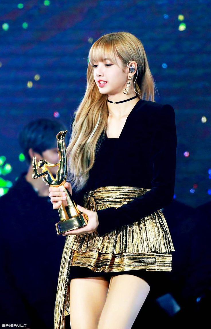 the singer is holding her award for best performance