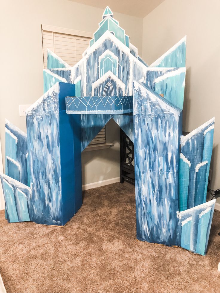 a blue and white castle made out of cardboard