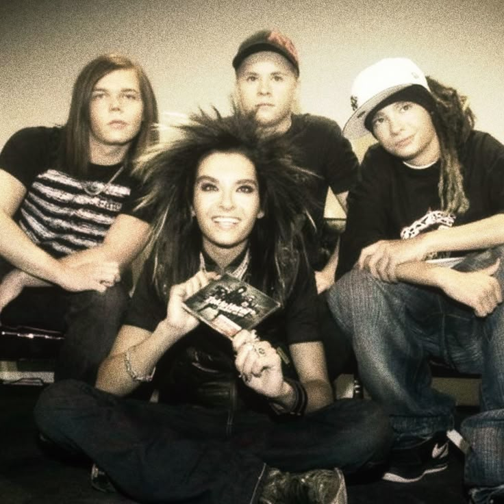 a group of young people sitting next to each other