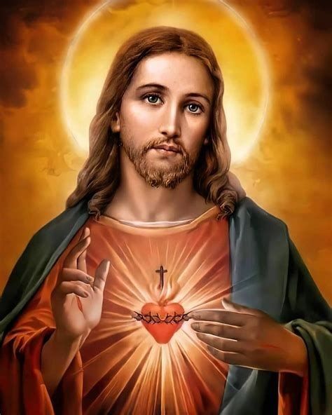 jesus holding the sacred heart with his hands