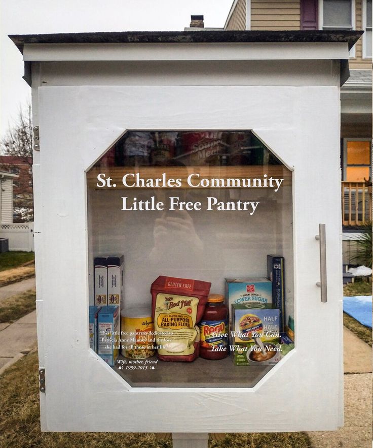 an advertisement for st charles's community little free pantry in front of a house