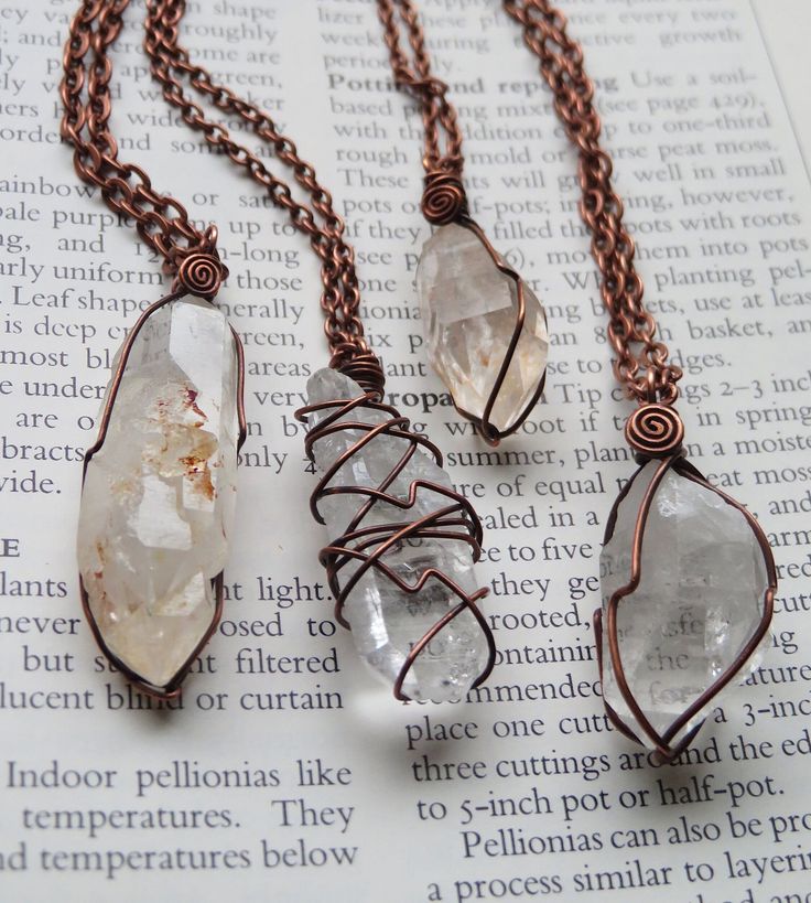 A selection of 4 totally magical and uniquely wrapped raw quartz crystal necklaces. Each wrapped in solid antiqued copper wire and strung on matching chain in your choice of length! Necklace A- Flat Clear Quartz Crystal Necklace B- Quartz with red iron inclusions and some cool crystal growth on one face!  Necklace C- Tangerine Quartz from Nova Scotia, has some peachy undertones Necklace D- Chunkier Clear Quartz Crystal Golden Enclaves, Crystal Necklace Copper, Crystal Necklace Aesthetic, Quartz Wire Wrapped Necklace Gift, Crystal Necklace Diy, Crystal Jewelry Ideas, Clear Quartz Crystal Necklace, Jewelry Modeling, Unique Copper Wire Wrapped Crystal Necklaces