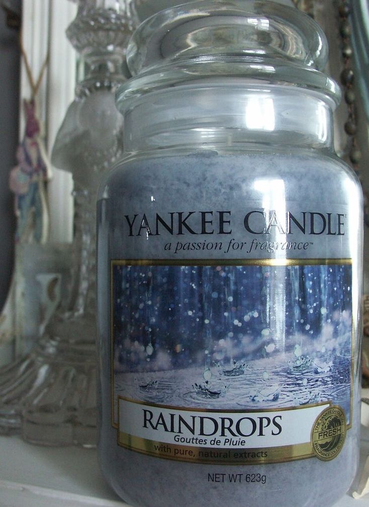 a yankee candle sitting on top of a shelf