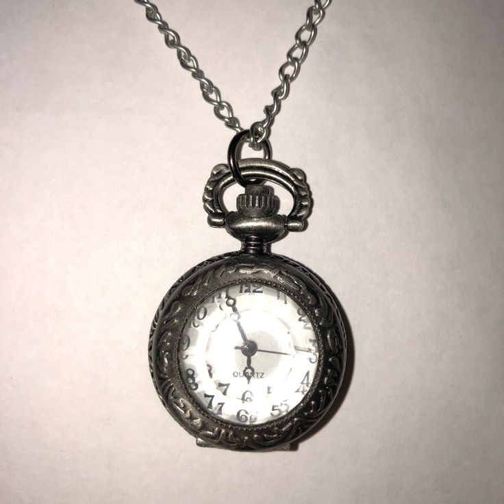 This Watch Necklace Is A Beautiful Antique Like Piece. The Front Cover Of This Watch Has Beautiful Pattern. Simply Press The Top Notch To Reveal The Face Of The Watch. A Fun And Simple Gift! Watch Measures 1in X .5 In X 1in. Chain Is 29 Inches Long. Silver Vintage Watches Women, Mermaid Artwork, Watch Pendant, Pretty Ear Piercings, Vintage Watches Women, Simple Gift, Accessories Vintage, Simple Gifts, Watch Necklace