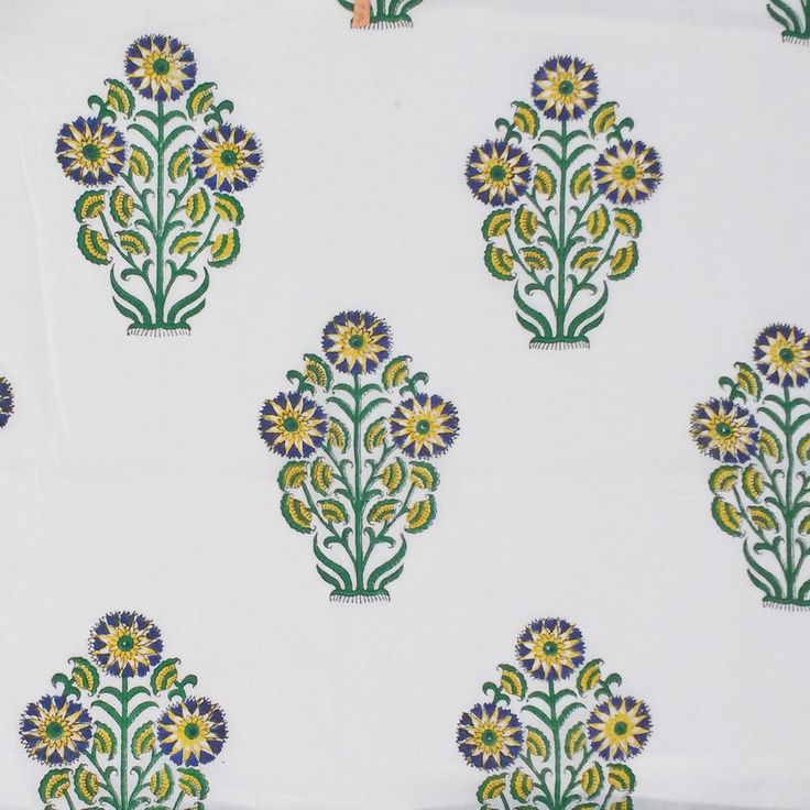 a white and green floral print fabric with small flowers on the front, in various colors