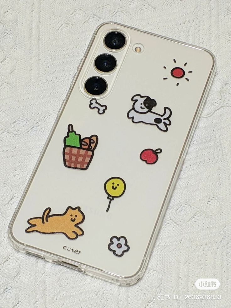 an iphone case with stickers on it sitting on top of a white sheeted surface