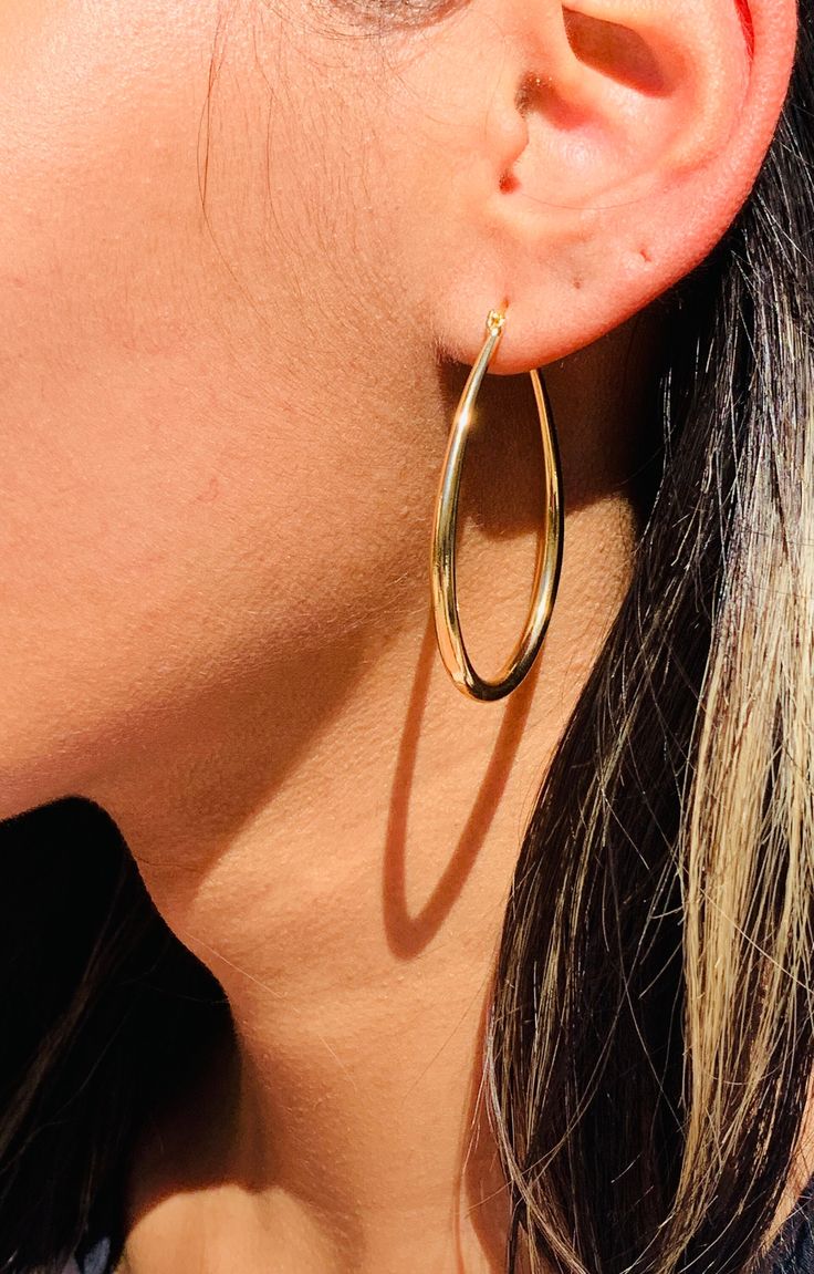 One of our best selling hoops! A lightweight statement pair perfect for everyday wear. 18kt Gold Filled Large Hoop Earrings Tarnish resistant- hypoallergenic- Lightweight Hoop Size: 50mm Width: 3mm Clasp: Hinged  Material: 18 Karat Gold Filled, Hypoallergenic. Tarnish Resistant. Gold-filled does not de-laminate or peel like Gold plated Jewelry nor does it tarnish as readily as silver. Generally speaking, gold filled is better quality and will have a much longer lasting color than plated jewelry. We recommend keeping abrasive chemicals away from the jewelry for the items to last. Thank you for visiting and supporting our small business! We hope you will find a stylish piece that speaks to you! ♥ All of our piece our carefully curated and handmade by our all-female team in Miami, Fl ♥ Our ma Trendy Teardrop Tarnish-resistant Hoop Earrings, Everyday Small Hoop Teardrop Earrings, Nickel-free Teardrop Hoop Earrings, Hypoallergenic Dangle Hoop Earrings, Simple Gold Hoop Earrings, Gold Filled Hoops, Earrings Dainty, Alessandra Ambrosio, Large Hoop Earrings