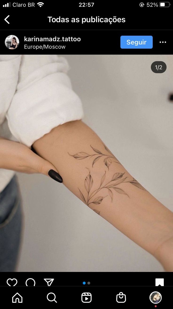 a woman's arm with a flower tattoo on the left side of her arm