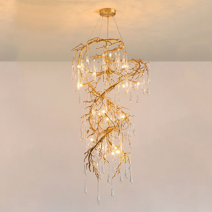 a chandelier with lights hanging from it's sides and branches in the middle