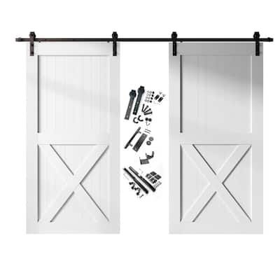 an open white barn door with hardware and tools