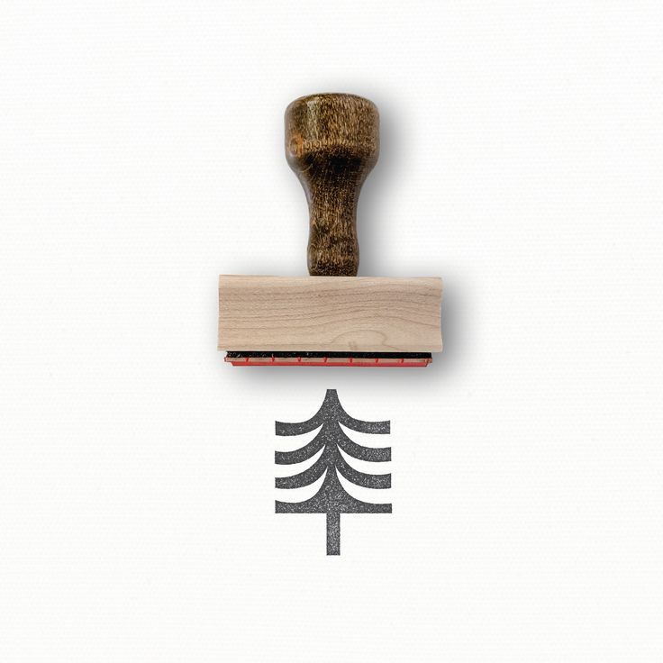 a rubber stamp with a pine tree on it