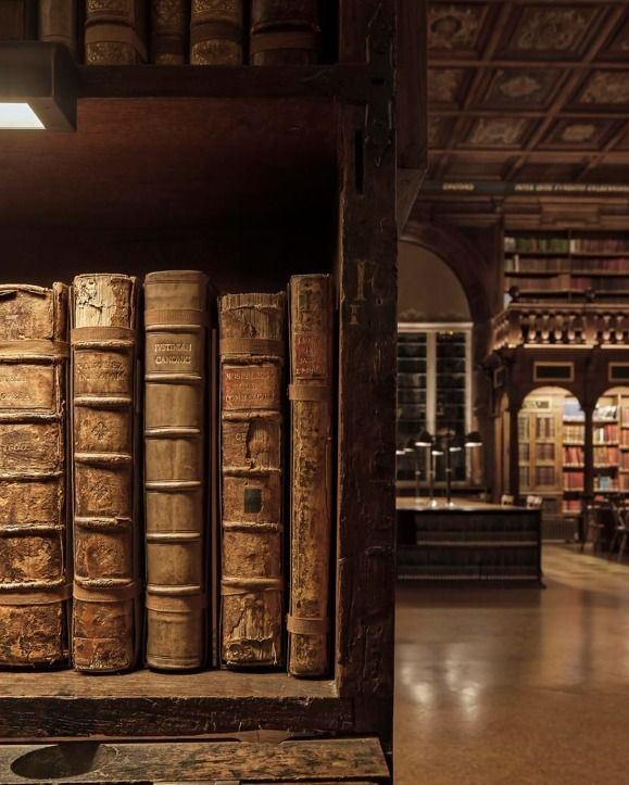 old books are stacked on top of each other