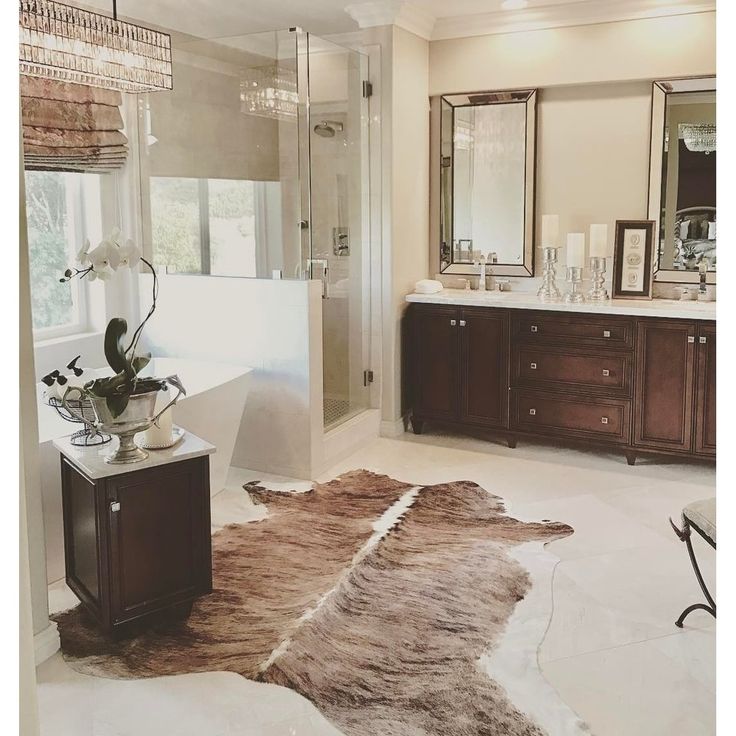 a bathroom with a large rug on the floor