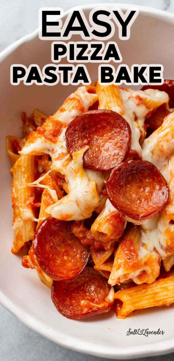 a white bowl filled with pasta and pepperoni