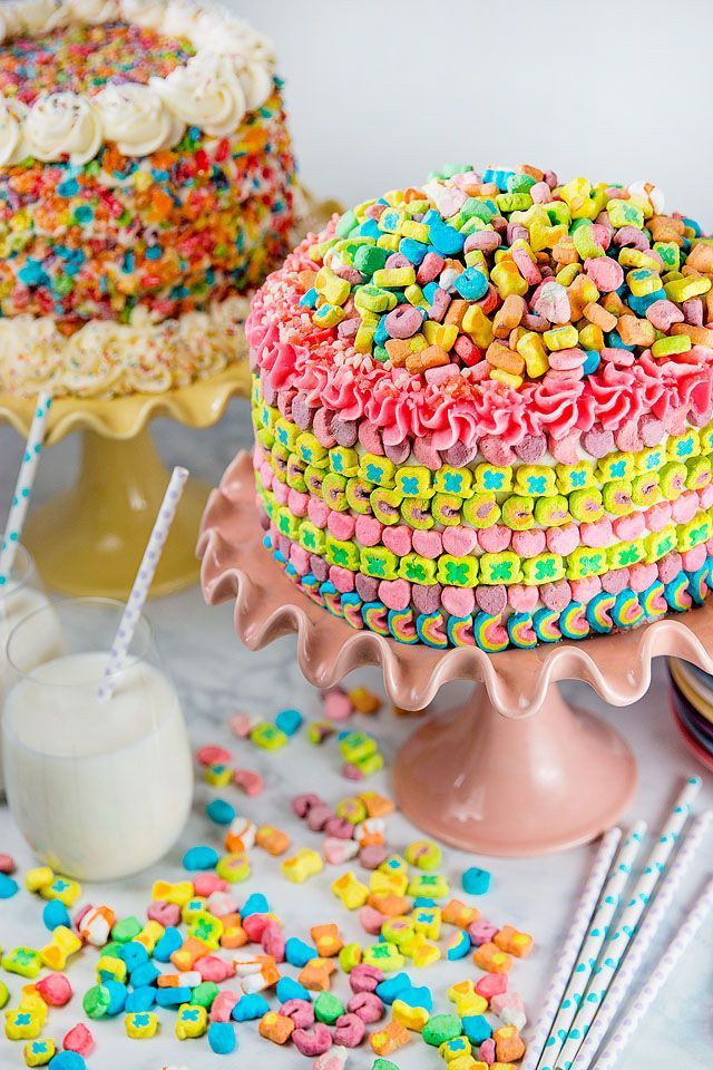 there is a cake with sprinkles on it and two drinks next to it