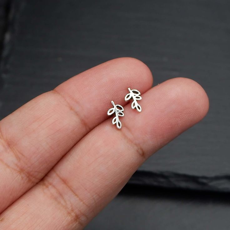 Real 925 Sterling Silver Tiny Leaf Vine Stud Earrings These lovely earrings can be used in Earlobe, Tragus and Cartilage. Measures 8.5 x 5 mm Comes with pushback backings Sold by Pair Jewelry will come in a gift box * Please read shop policy before placing an order * *JEWELRY CARE* Sterling Silver will tarnish over time, but to help keep your jewelry looking beautiful - Clean with a soft dry cloth after wear and store inside an airtight bag or container. Remember to remove your jewelry when: * A