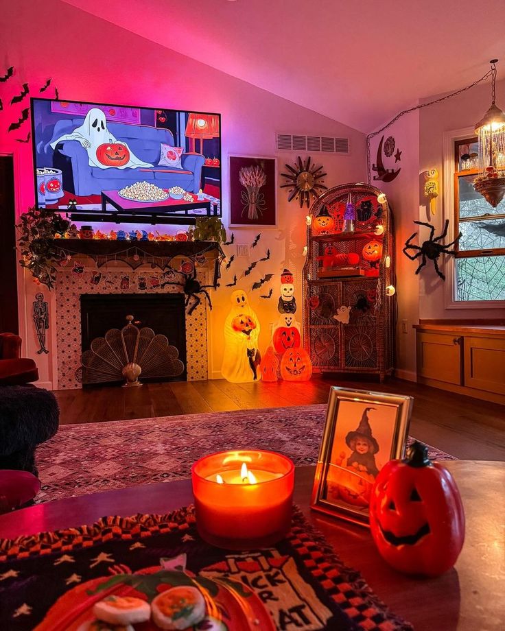 a living room decorated for halloween with candles and decorations