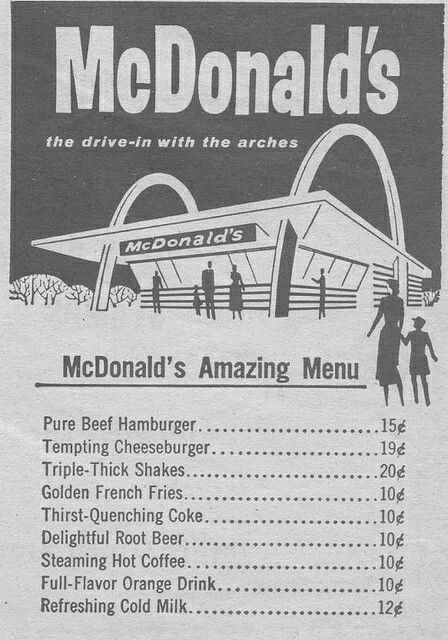 the menu for mcdonald's is shown in black and white, with people standing outside