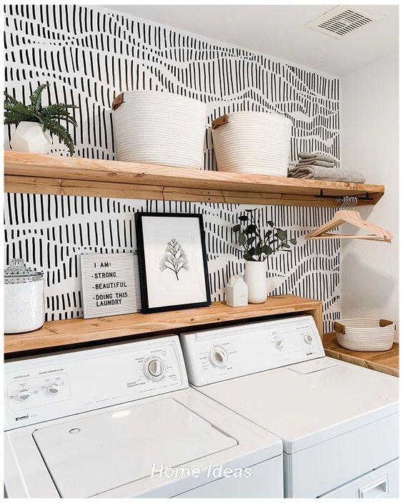 a white washer and dryer sitting next to each other in a laundry room