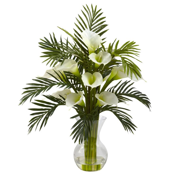 a vase filled with white flowers on top of a table