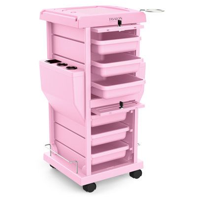 a pink trolley with drawers and wheels on the bottom, is shown in front of a white background