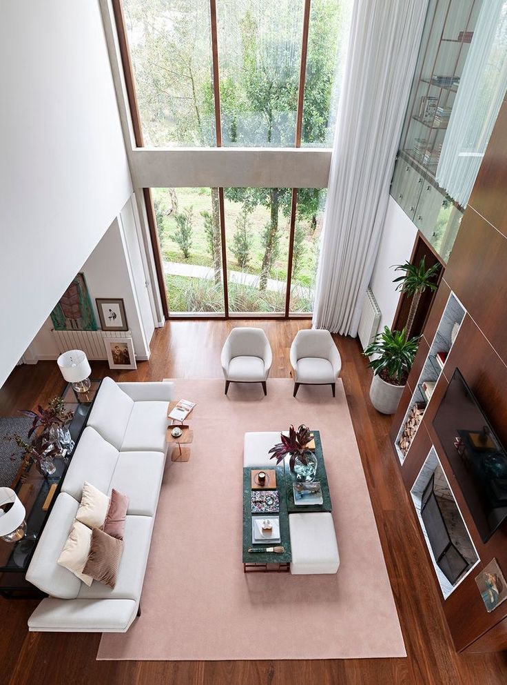 an overhead view of a living room with white furniture