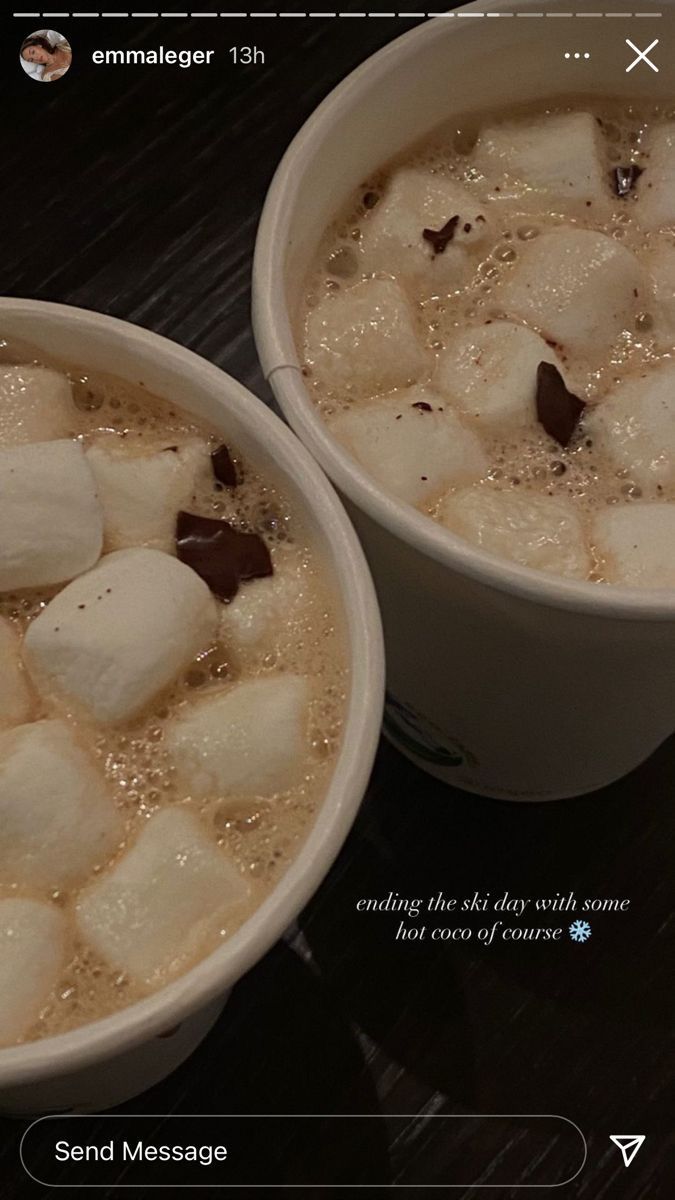 two bowls filled with ice cream and marshmallows on top of a table