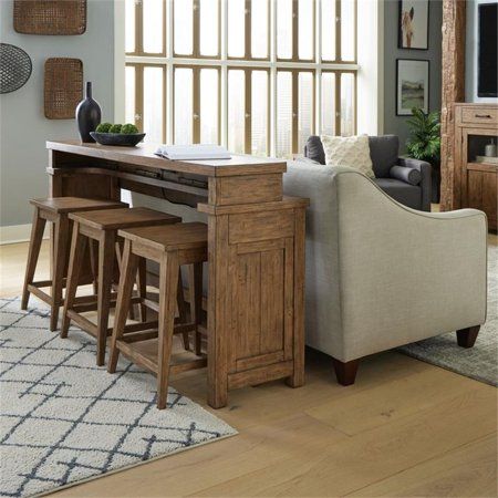 a living room filled with furniture and a wooden table in front of a large window