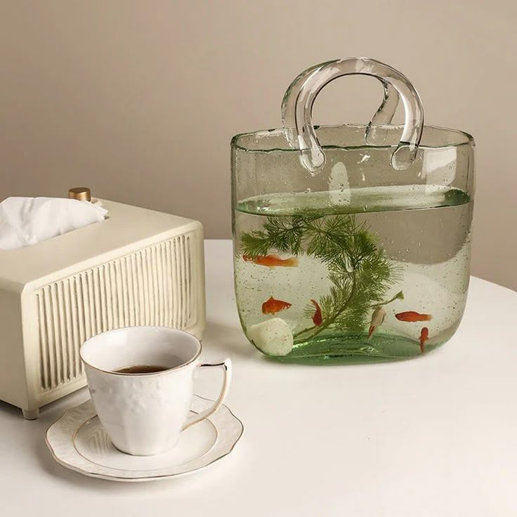 this vase bag reminds me of the coperni glass bag shop here: https://cremecloud.net/products/bag-vase?ref=bb997 or link on my story Bag Flower Vase, Creative Fish Tank, Fish Tank Home, Bag Vase, Flower Table Decorations, Glass Bag, Bedroom Things, Round Gift Boxes, Acrylic Vase