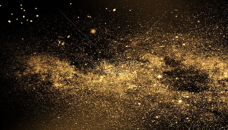 gold dust is flying through the air in front of a black background with white dots