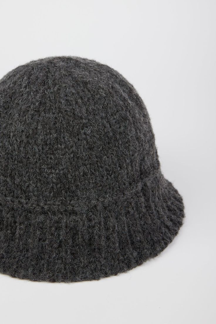 - Measurements: 1. Circumference: 60cm, 2. Length : 16cm- Materials: 50% acrylic, 30% wool, 20% nylon- Thickness: Moderate- Sheerness: None- Stretch: None- Lining: None- Care: Dry clean or hand wash cold and dry in shade Ribbed Wool Hat For Fall, Fall Ribbed Wool Hat, Casual Wool Cloche Hat For Winter, Wool Winter Bucket Hat, Classic Winter Bucket Hat, Casual Wool Bucket Hat With Curved Brim, Casual Wool Bucket Hat, Knitted Cloche Hat With Curved Brim For Winter, Winter Knitted Brimmed Cloche Hat