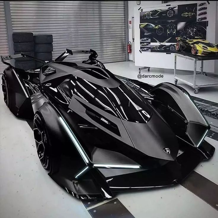 a black batmobile is parked in a garage