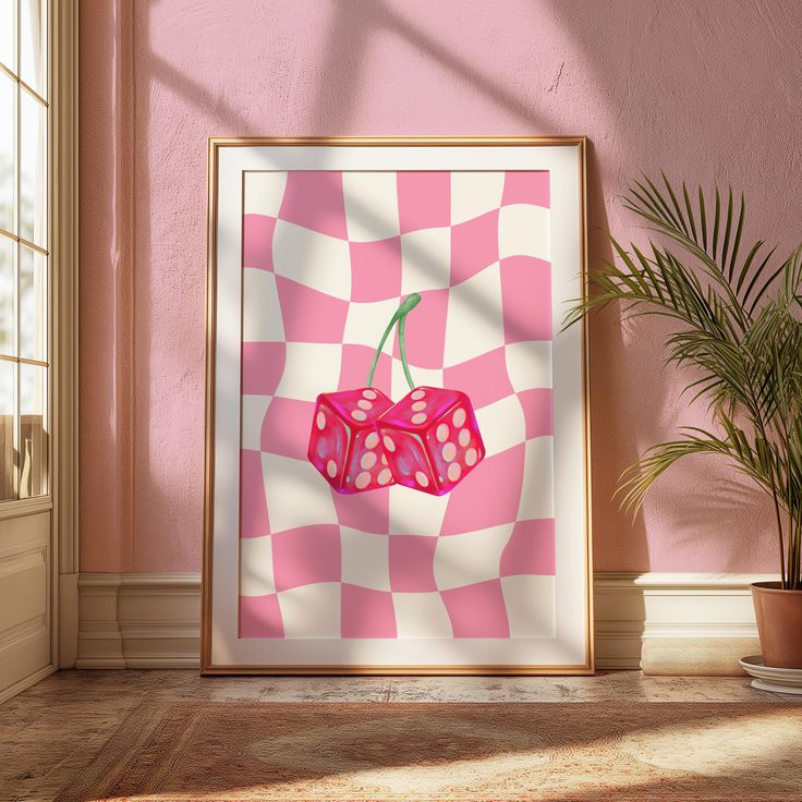 a pink and white checkered poster with a cherry on it in front of a potted plant