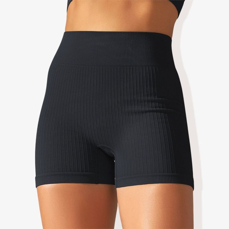 The Anna-Kaci Women's Wide Band Stretchy Rib Knit Seamless Gathered Biker Shorts are a must-have for your activewear collection. These shorts feature a wide band that offers a secure and comfortable fit, enhancing your silhouette with shaping seams. Made from stretchy rib knit fabric, they provide excellent flexibility and movement while maintaining a seamless construction for a smooth, irritation-free experience. The gathered detail adds a touch of style, making these biker shorts perfect for w Black Seamless Activewear With Built-in Shorts, Seamless High Waist Biker Shorts, High Waist Solid Seamless Biker Shorts, Black Seamless Mid-thigh Bottoms, Black Stretch Seamless Shorts, Seamless Black Biker Shorts, Fitted Seamless Biker Shorts, Black Compression Seamless Shorts, Compression Seamless Black Shorts