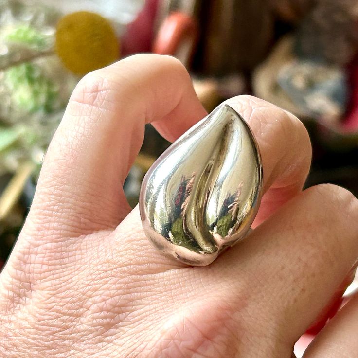 "Vintage Modernist Mexican Ring Fire Flame Size 8 1/2 Sterling Silver Super Hero Ring Made in Mexico Let your light shine with this stunning Mexican statement ring. Made from solid sterling silver, the flame measures 1 1/4\" (32 mm) tall and just under 1 inch (23 mm) wide. It is stamped with a Taxco, Mexico maker's mark on the inside of the band. This ring measures a size 8.5 on a ring mandrel. It weighs a solid 13 grams. The ring is in excellent vintage condition with some visible signs of age and previous wear.  Is it a gift? Need to buy a card? All cards ship free with purchase. http://www.etsy.com/shop/AdobeHouseVintage?section_id=13802190 Thanks so much for looking!" Silver Teardrop Ring With Polished Finish, Mexican Ring, Flame Ring, Mexico Jewelry, Modern Flames, Ring Mandrel, Abstract Jewelry, Fire Flame, Let Your Light Shine