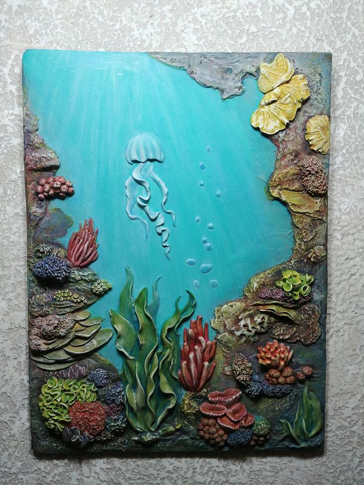 an underwater scene with corals, seaweed and other marine life is shown on the wall