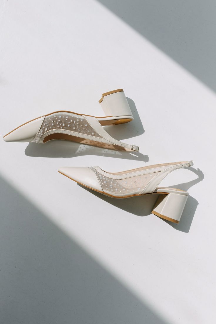 Wedding slingback pumps 'ICON' are handcrafted from soft ivory Italian leather. The pair of bridal heels features handmade sequin and bead embroidery on the soft mesh. This design also has pointy toes and a 5.5 cm / 2.2 inches stable block heel.  Inside there is a soft Memory foam insole, which gives a feeling of additional comfort when walking. Tunit outsole is made of a mixture of leather chips and rubber, it's more wear-resistant than leather and more durable. Also, we use soft natural upper Wedding Pumps, Beads Embroidery, Bridal Heels, Embroidered Wedding, Womens Wedding Shoes, Low Block Heels, Slingback Heel, Slingback Pump, Custom Shoes