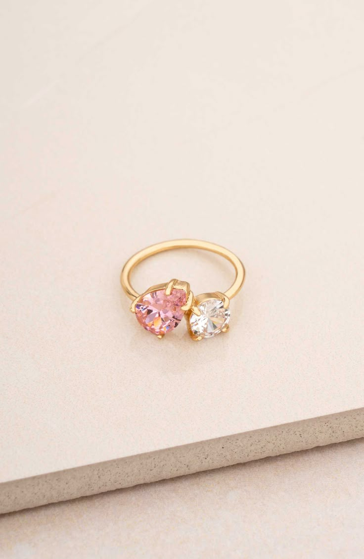 A mixed duo of cubic zirconia shimmers brilliantly atop this slender ring band plated in 18-karat gold. Cubic zirconia/18k-gold plate Imported Matching Sister Rings, Pink Diamond Gold Ring, Colorful Promise Rings, Couple Birthstone Ring, Gold Promise Rings For Her, Senior Ring, Eclectic Engagement Rings, Senior Rings, Pink Rings