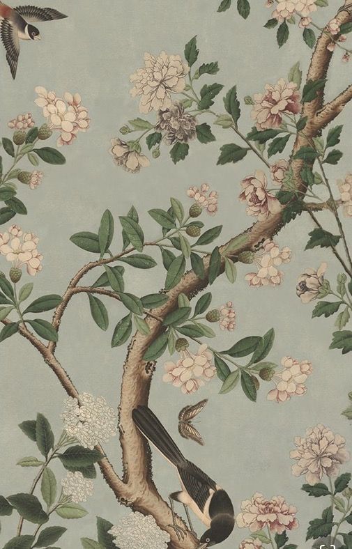 a bird sitting on top of a tree branch next to flowers and birds flying around