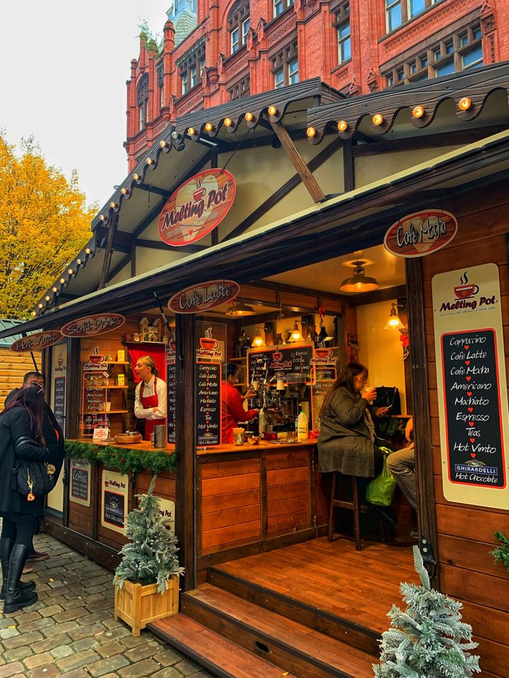 people are walking in and out of a restaurant