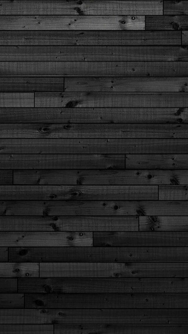 black and white photo of wood planks with no one in the room on it