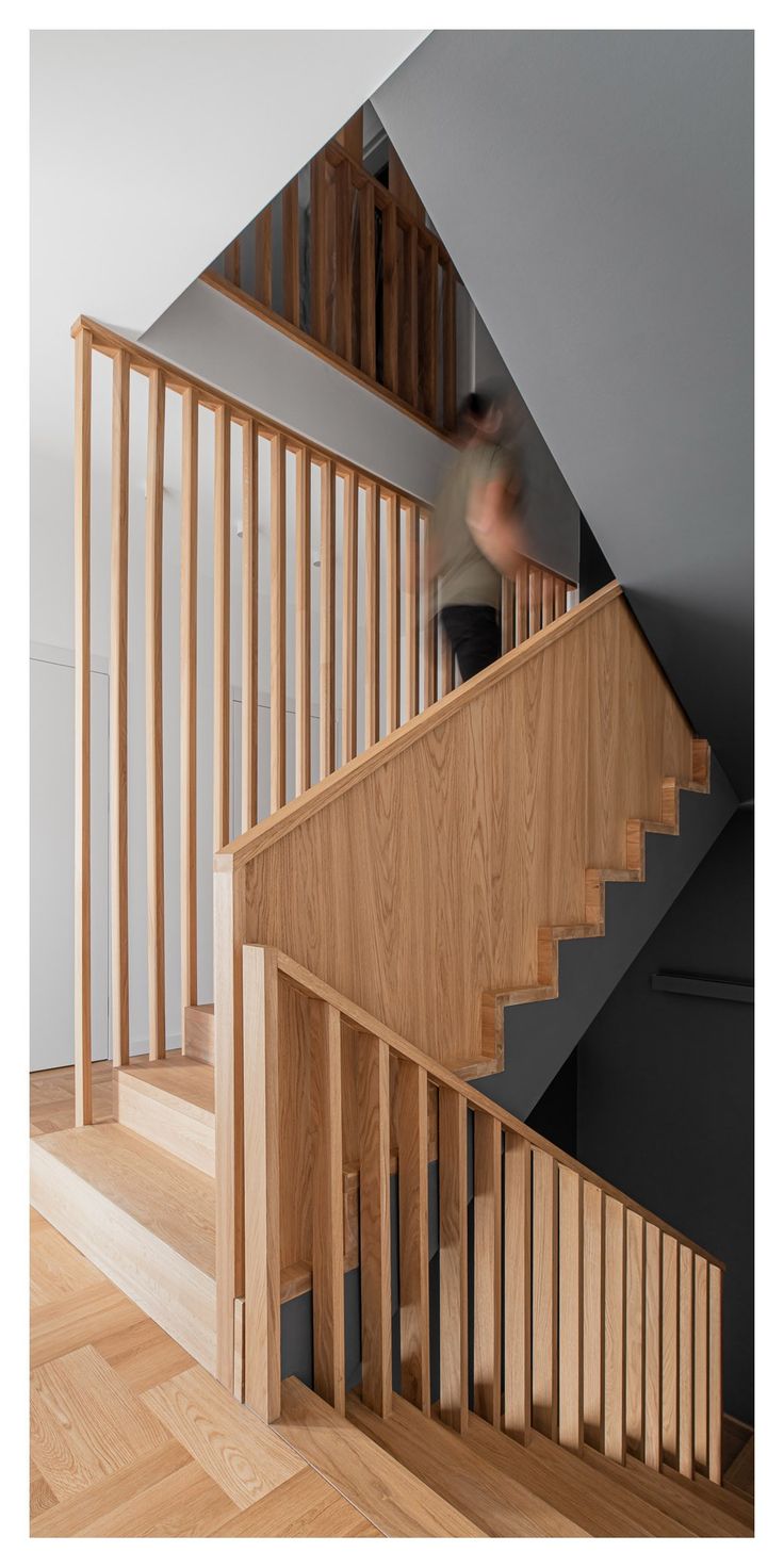 a person walking up some stairs in a house