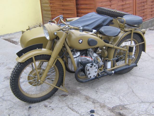 an old motorcycle is parked on the street