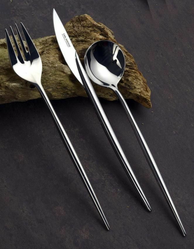 three forks and two spoons sitting next to each other on a piece of wood